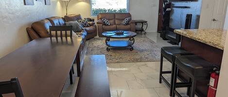 Smart TV, fireplace, books, computer monitors