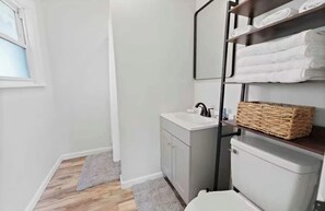 Shower, hair dryer, towels, shampoo