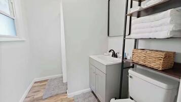 Shower, hair dryer, towels