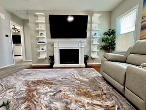 Smart TV, fireplace, books