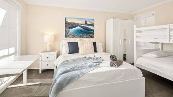 4 bedrooms, desk, iron/ironing board, travel cot