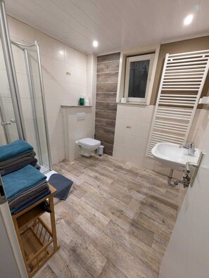 Shower, hair dryer, towels, soap