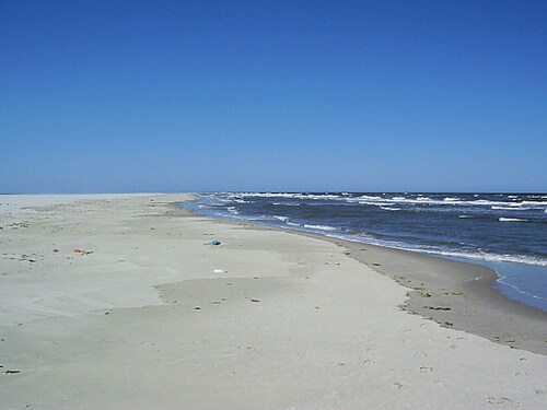 Holiday home with private garden by the sea