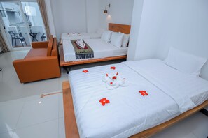 Family Triple Room, City View | Premium bedding, in-room safe, soundproofing, free WiFi - Bliss & Beats Hostel (Phnom Penh)