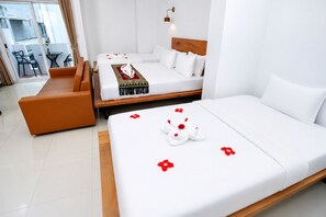 Family Triple Room, City View | Premium bedding, in-room safe, soundproofing, WiFi (free) - Bliss & Beats Hostel (Phnom Penh)