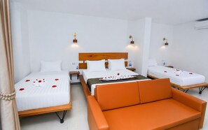 Family Triple Room, City View | Premium bedding, in-room safe, soundproofing, WiFi (free) - Bliss & Beats Hostel (Phnom Penh)