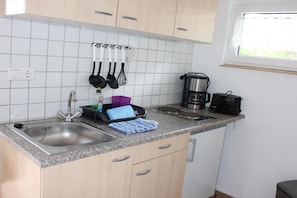 Fridge, stovetop, coffee/tea maker, toaster