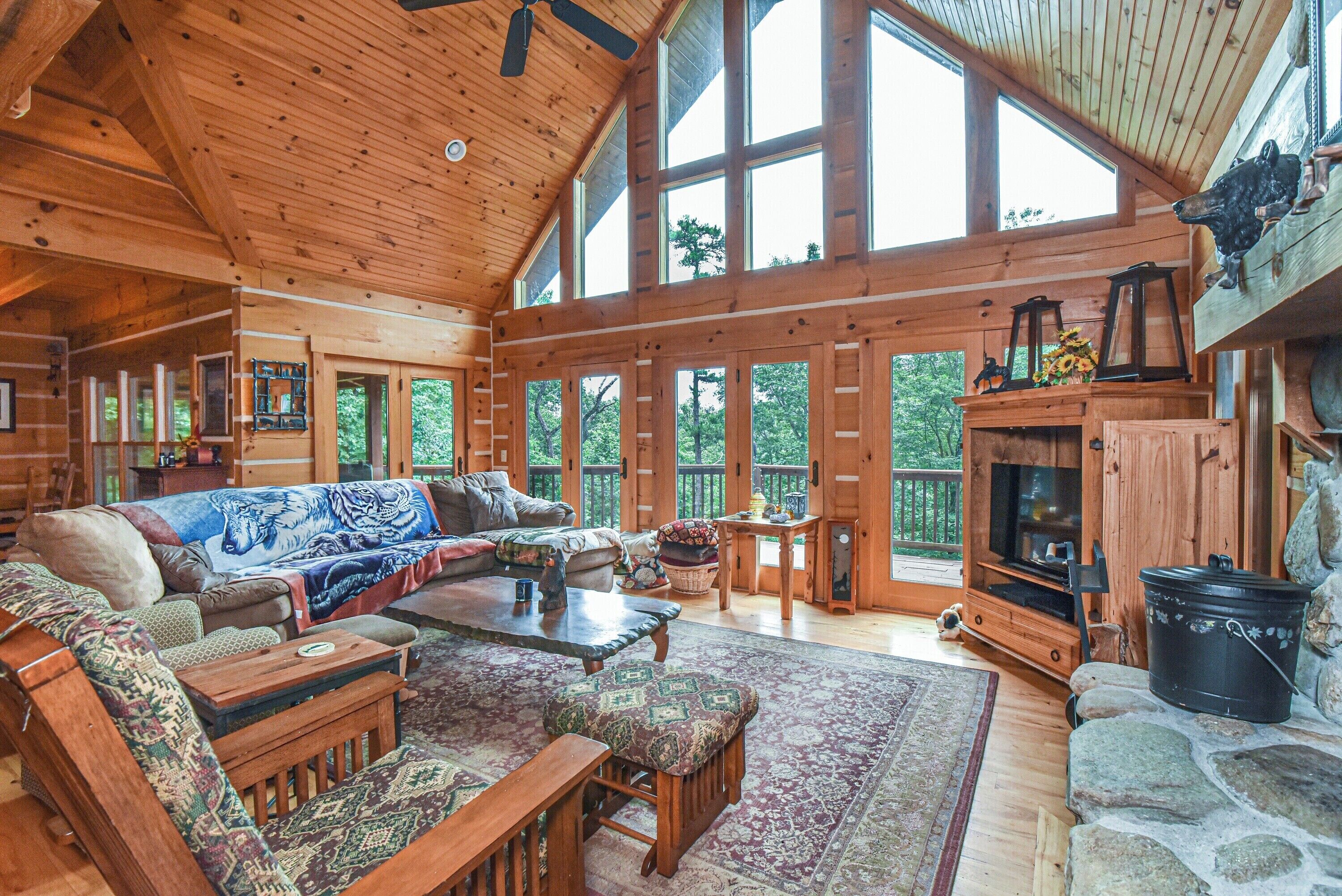 Signature Cabin, 3 Bedrooms, Hot Tub | Living room | 50-inch Smart TV with digital channels, fireplace, foosball