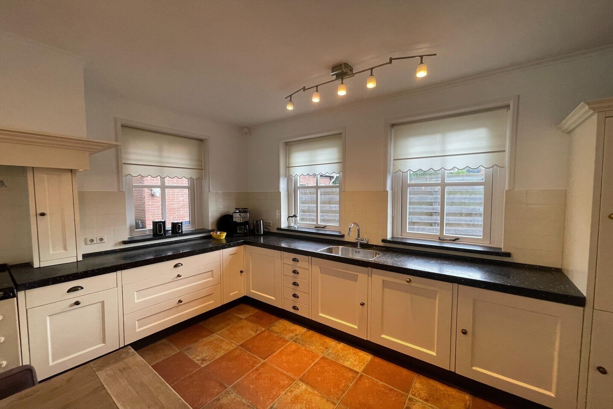 Fridge, stovetop, dishwasher, coffee/tea maker