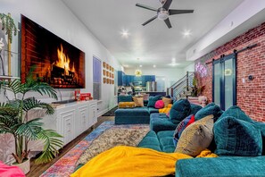 Smart TV, fireplace, table football, books