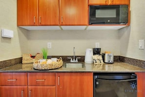 Coffee/tea maker, microwave, toaster, cookware/dishes/utensils