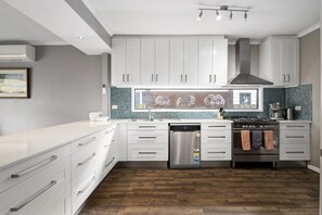 Microwave, dishwasher, coffee/tea maker, cookware/dishes/utensils