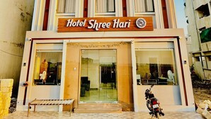 A multi-story hotel with a prominent sign reading "Hotel Shree Hari". - HOTEL SHREE HARI (Dwarka)
