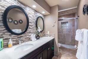 Shower, hair dryer, towels, shampoo