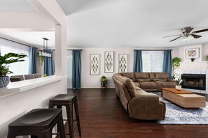 Smart TV, fireplace, books, computer monitors