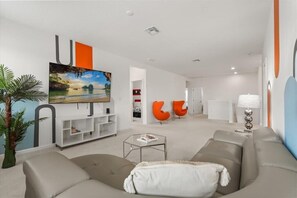 TV, offices - 8BR Retro Retreat | 70s-Themed Loft & Fun Themed Bedrooms (Kissimmee)