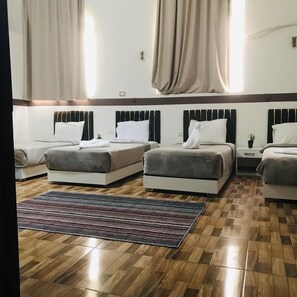 Comfort Quadruple Room | In-room safe, individually decorated, individually furnished
