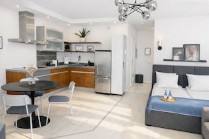 Comfort Apartment, Balcony, City View | Living area | 50-inch Smart TV with cable channels, Netflix, streaming services