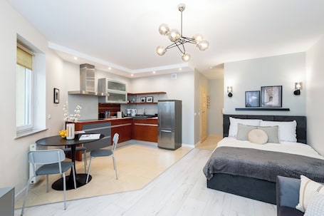 Comfort Apartment, Balcony, City View | Living area | 50-inch Smart TV with cable channels, Netflix, streaming services