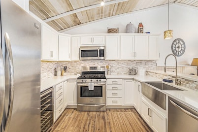 Sunset Landing: Waterfront Luxury Condo with High End Finishes Throughout