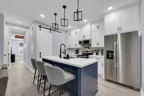 Relax + Unwind in this Modern & Spacious Townhome With 2 Car Garage