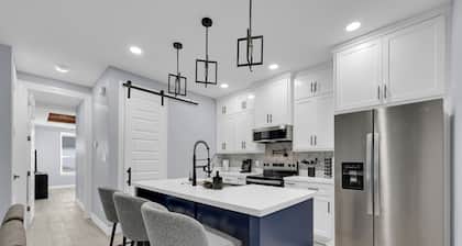 Relax + Unwind in this Modern & Spacious Townhome With 2 Car Garage