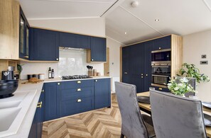 Fridge, microwave, cookware/dishes/utensils