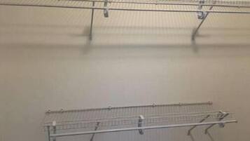 A storage closet with metal shelving units.