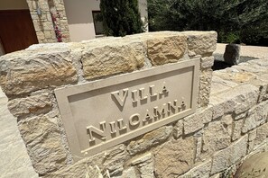 Experience the charm of Villa Niloammi, a traditional property with a rustic stone facade and a sense of heritage.