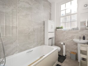 Shower, hair dryer, towels