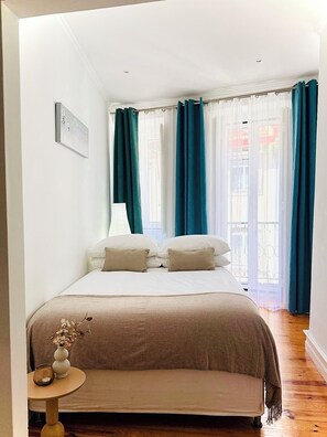 1 bedroom, desk, iron/ironing board, travel crib