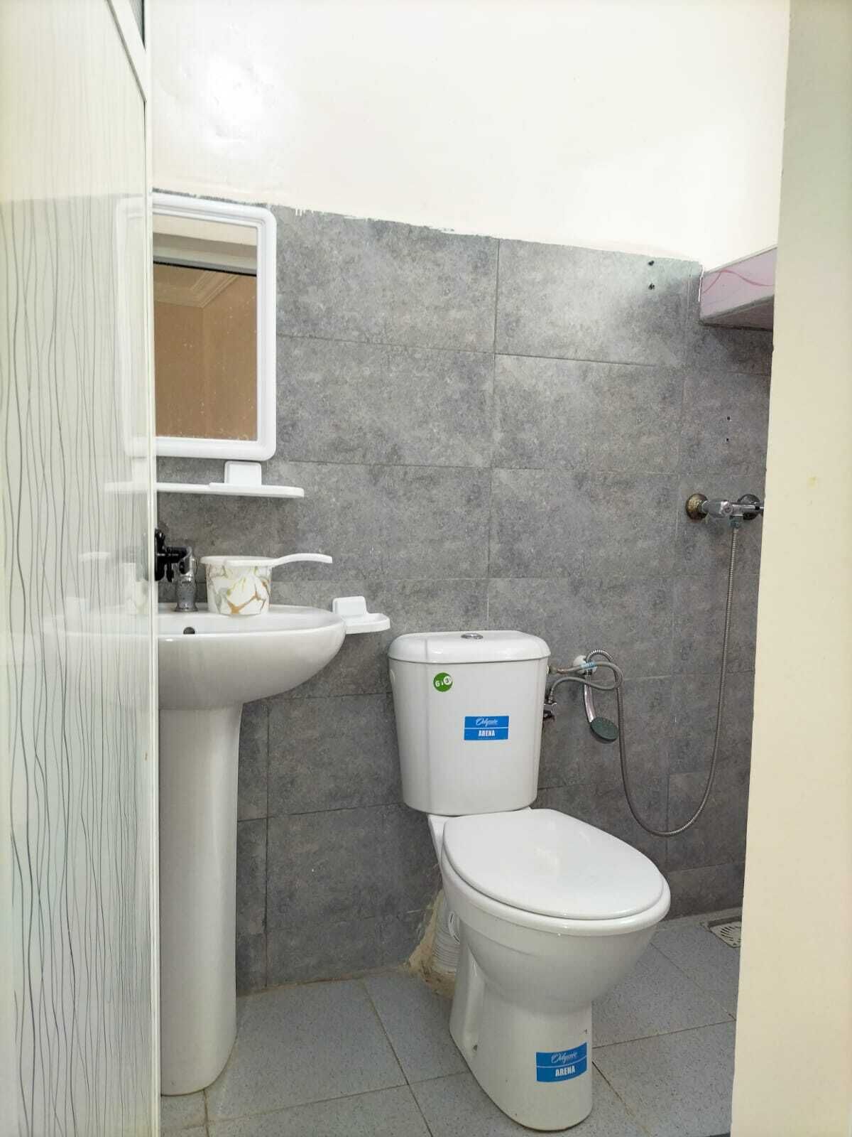 Economy Triple Room, City View | Bathroom | Shower, rainfall showerhead, bidet, toilet paper