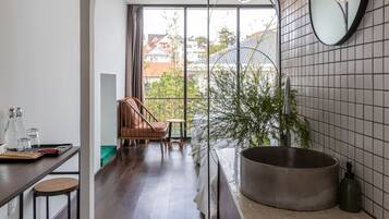 Deluxe Quadruple Room, Balcony, City View | Premium bedding, individually decorated, desk, laptop workspace
