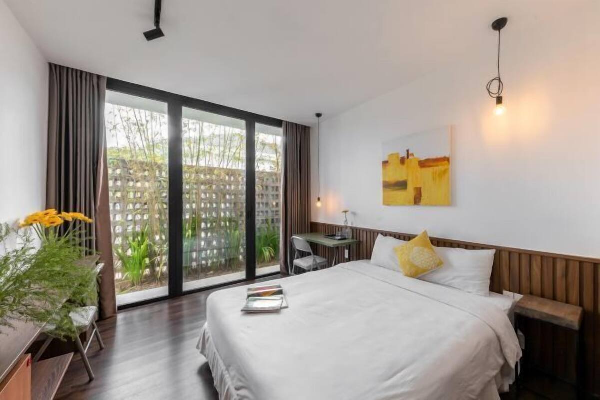Premium bedding, desk, laptop workspace, blackout curtains