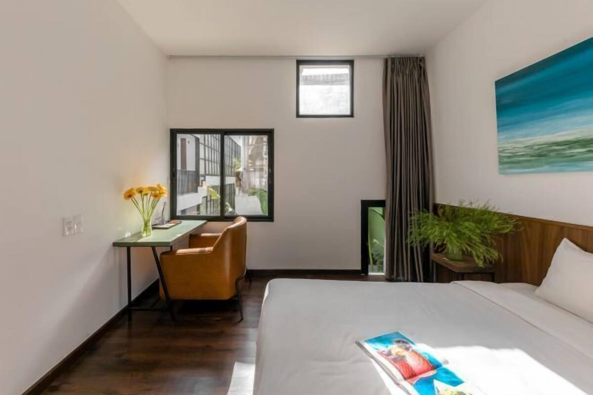 Premium bedding, desk, laptop workspace, blackout curtains