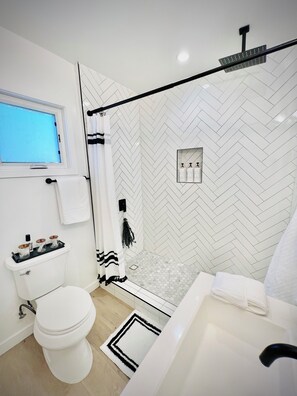 Shower, hair dryer, towels, soap