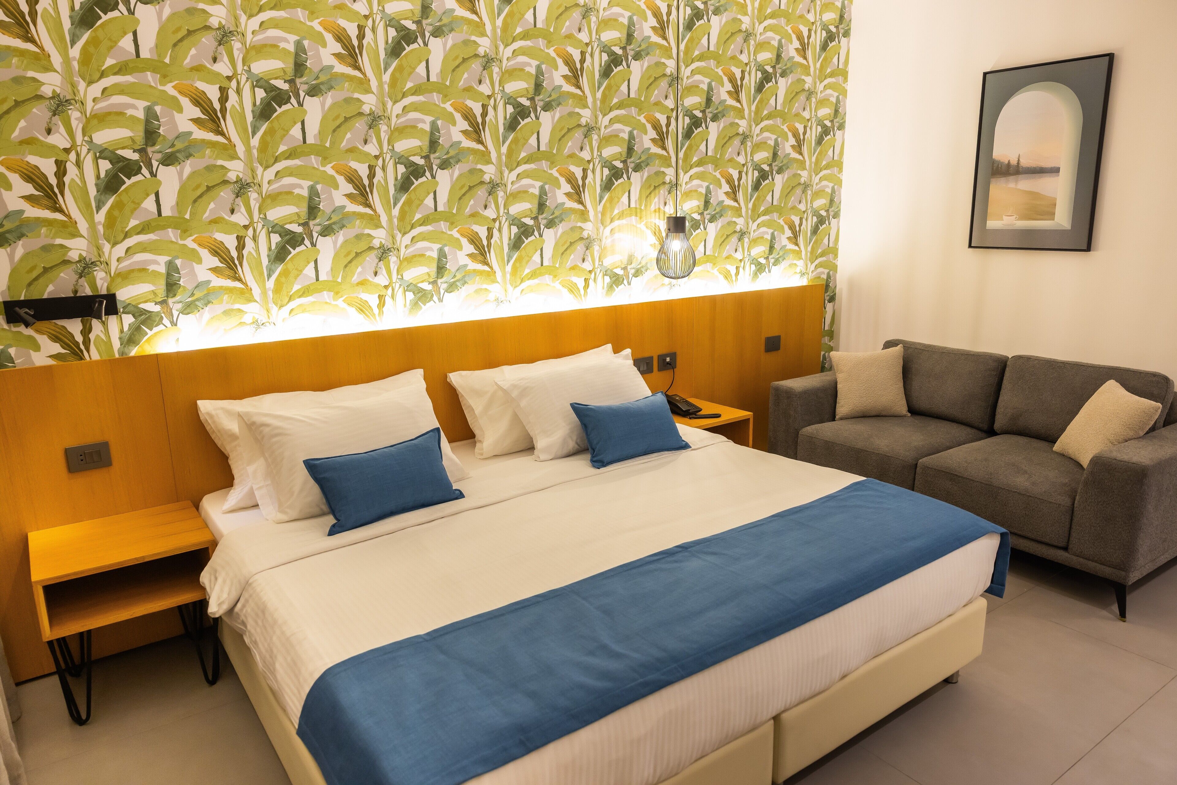 Deluxe Room, Balcony, Pool View | Minibar, in-room safe, soundproofing, iron/ironing board