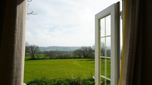 A view through an open window with a countryside landscape. - Primrose (With Hot-Tub) (Reynalton)