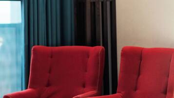 Comfort Double Room, Balcony, River View | Living area | 32-inch Smart TV with satellite channels