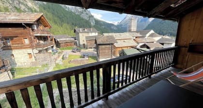 Chalet in the mountains, wooden interior, cosy, with a beautiful view