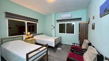 Apartment, Lanai, Courtyard View | 3 bedrooms, in-room safe, laptop workspace, blackout drapes