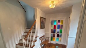 A staircase with wooden steps and white railings leading to a landing. - Large 3-bedroom house in a quiet neighborhood in the village of Canton, NY (Canton)