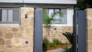 A stone wall with a sign indicating 'Morea Club 1888 West House'. - Morea Club West House with Private Heated Pool (Kalamat)