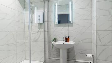 Shower, hair dryer, towels, soap