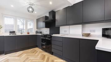 Coffee/tea maker, fridge, microwave, oven