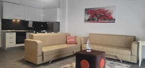 Familjelägenhet - balkong - utsikt mot staden | Vardagsrum