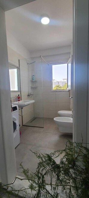 Family Apartment, Balcony, Sea View | Bathroom | Shower, hair dryer, towels, soap