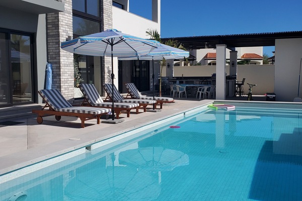 Private pool with fountain and lights