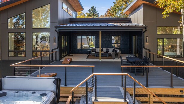 A modern house with a deck, outdoor seating, and a hot tub. - Secluded, modern, spectacular views, hot tub on 18 acres. Firepit,games & more! (Sewanee)