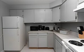Fridge, microwave, oven, stovetop - Explore Northside from Modern Studio Apartment near Dining and Shops + Laundry (Chicago)